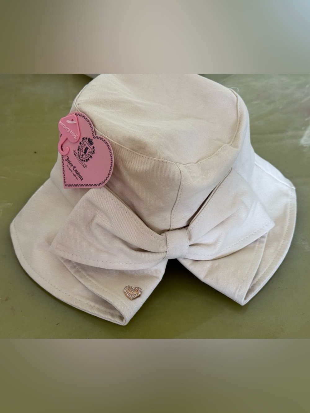 Juicy Couture Cream Bucket Hat with Bow and Gold Heart Charm